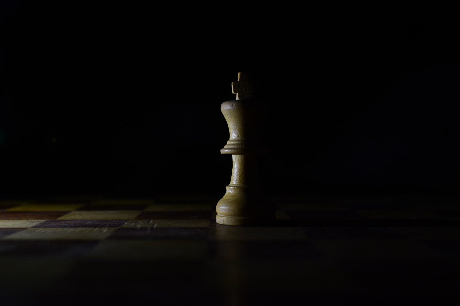 white chess king in the dark